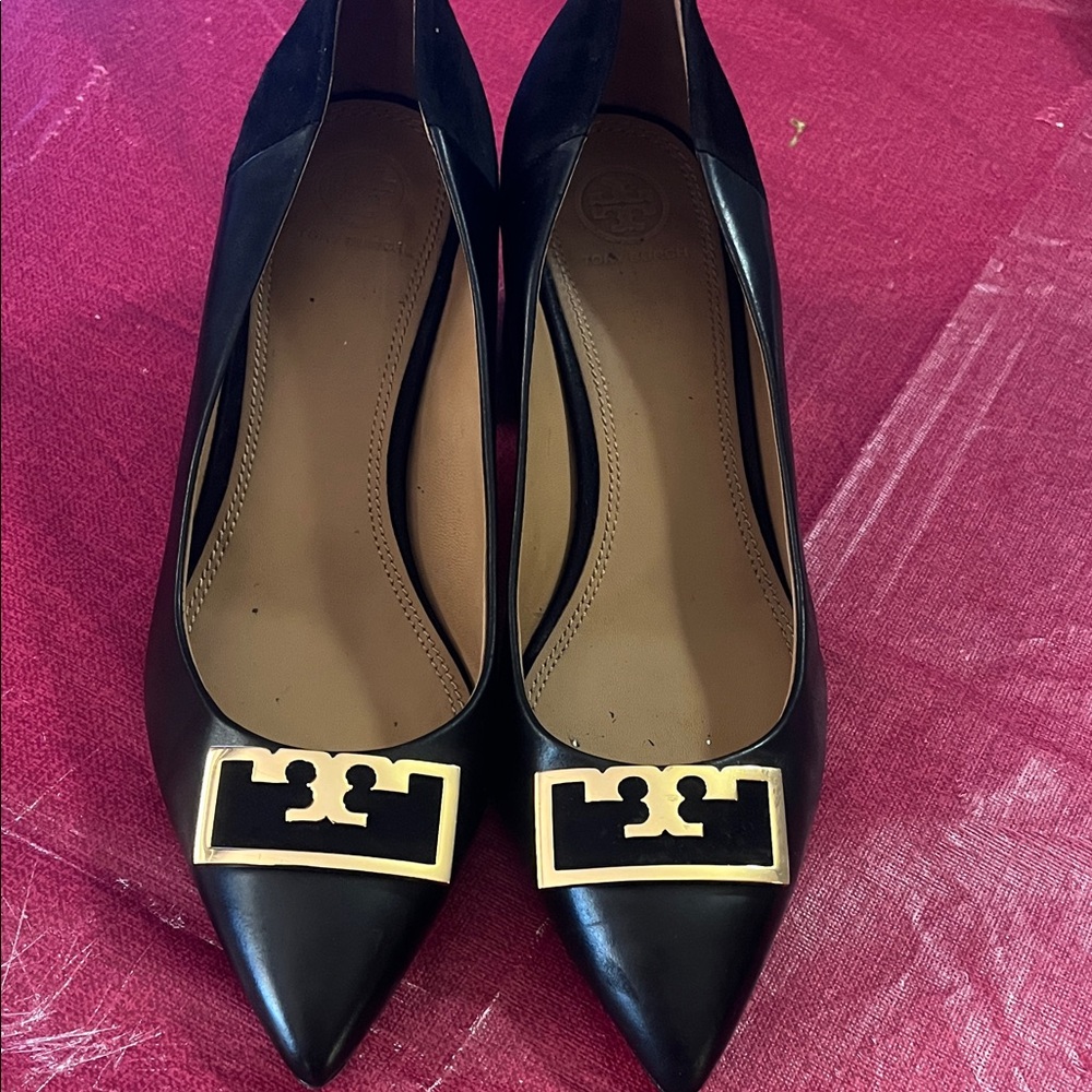 Tory Burch Black Pointed Toe Heels with Gold Logo Plaque